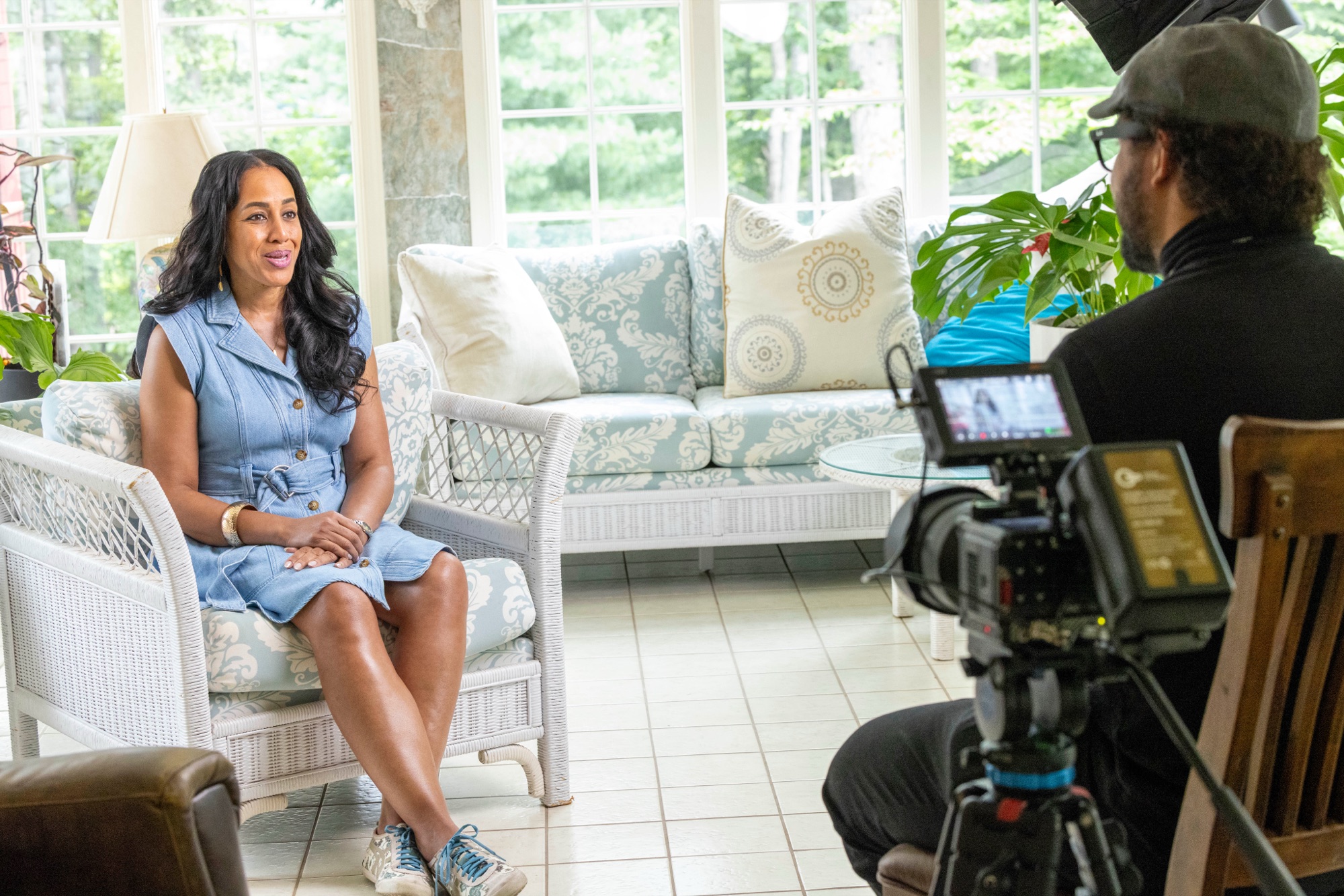 A Frame + Focus client on camera during an on-location interview shoot