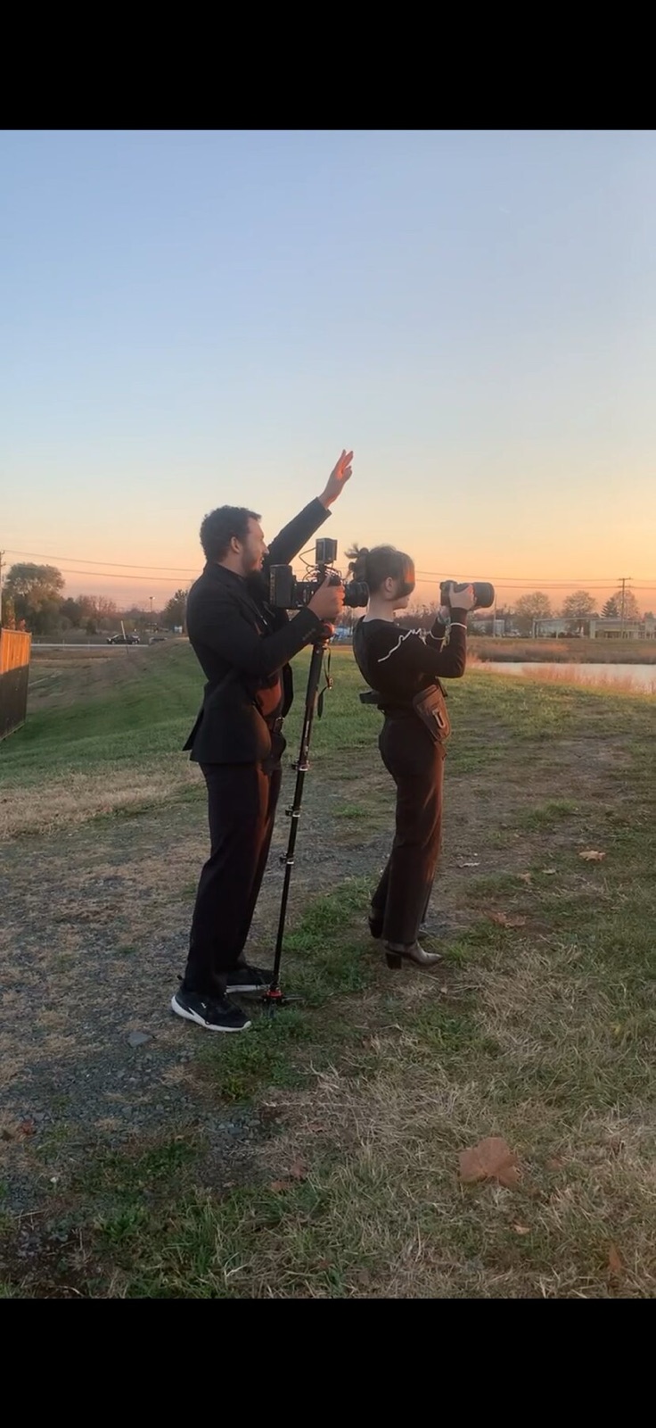 Marcus and his wife shooting side by side at sunset