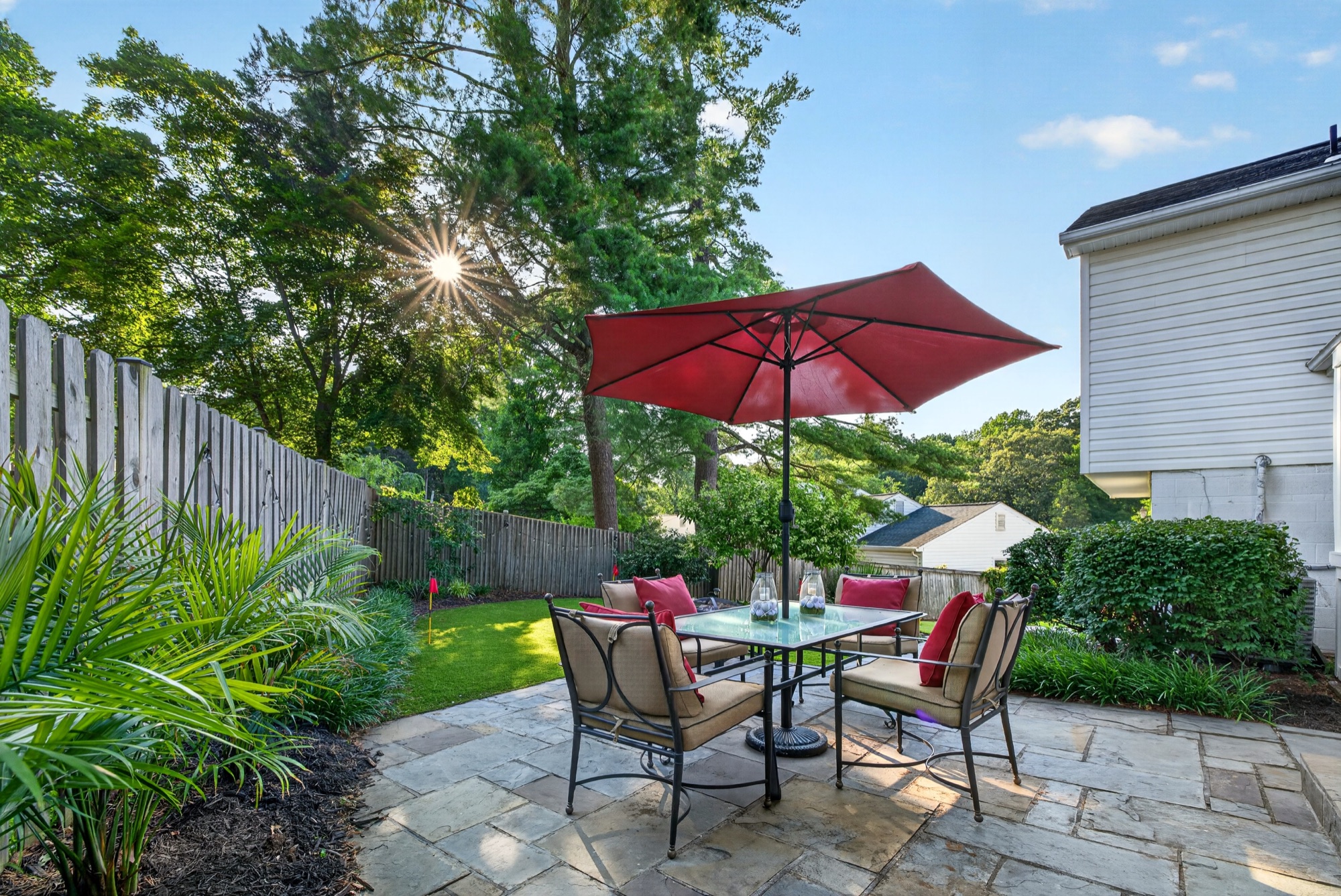 Backyard patio with umbrella dining set